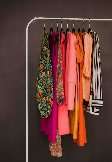 clothing rack with colorful clothes